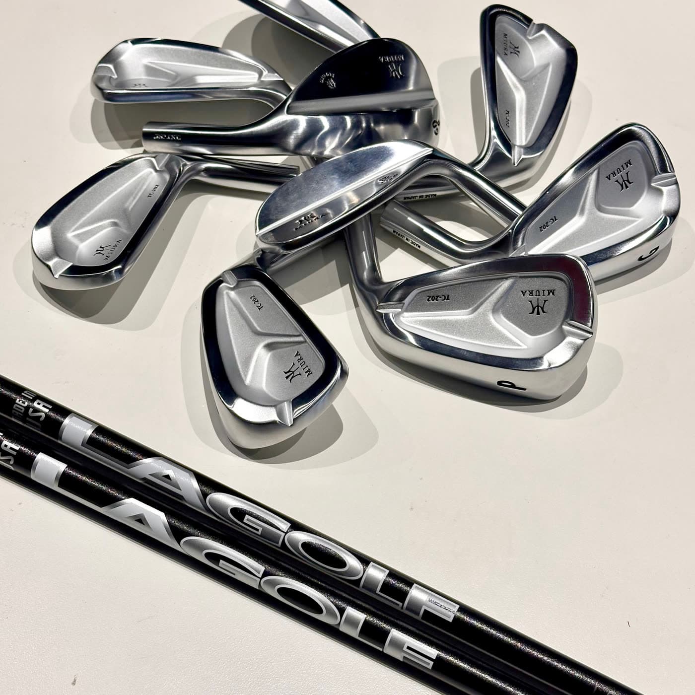 Miura TC-202 iron heads alongside LA Golf shafts before assembly